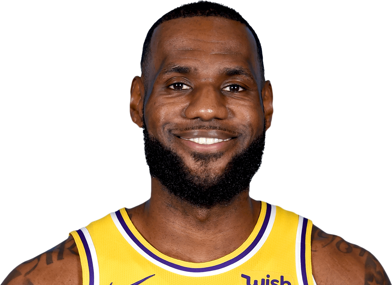 a man in a yellow jersey smiles at the camera