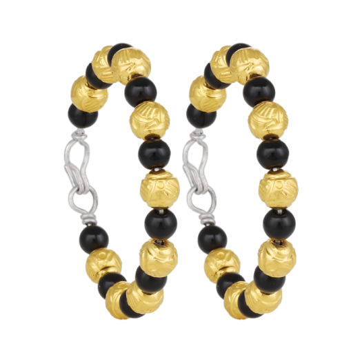 a pair of black and gold hoop earrings