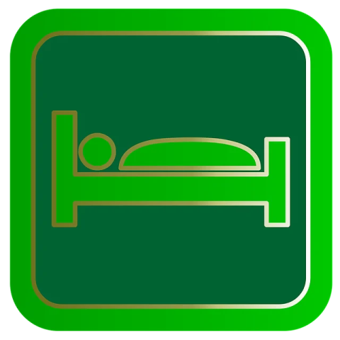 a green and gold bed icon