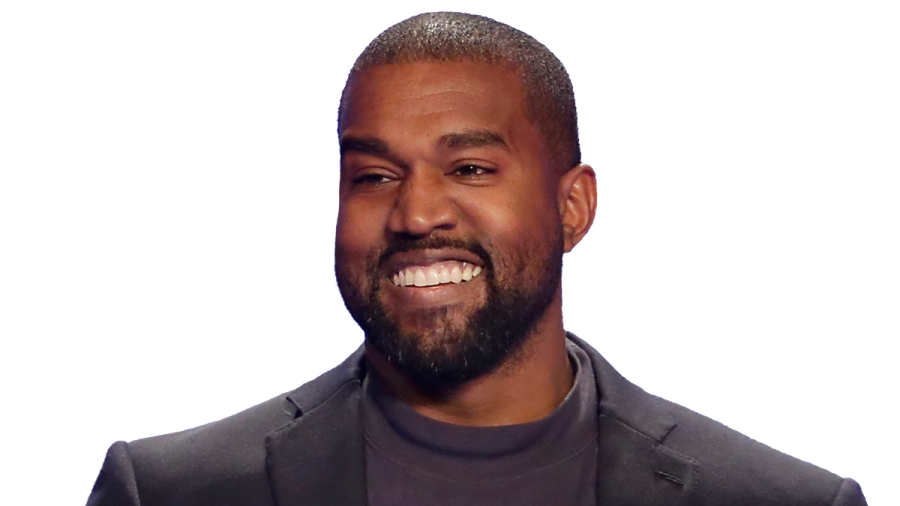 a man with a beard smiles at the camera