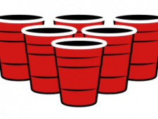 a red bucket filled with black plastic cups