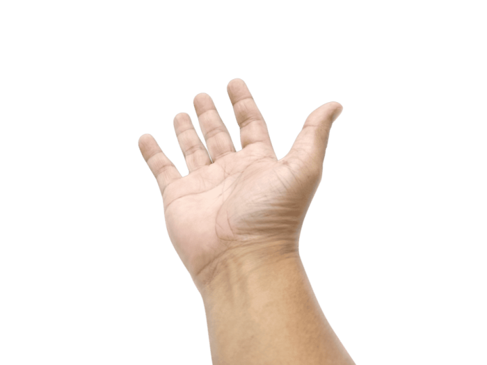 a person's hand reaching up to the sky