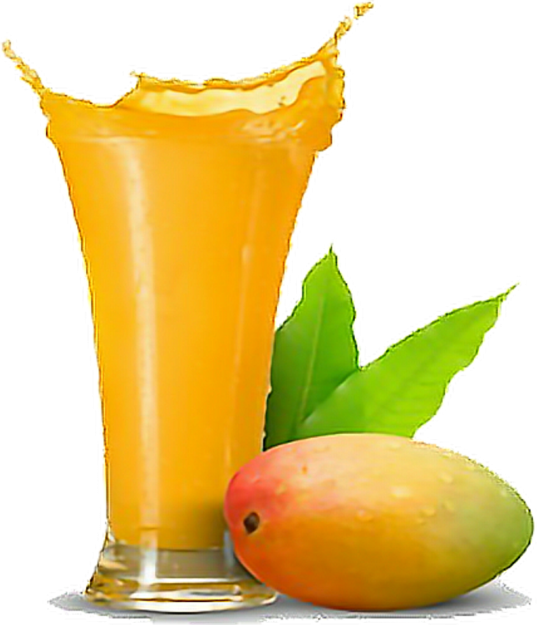a glass of mango juice next to a mango