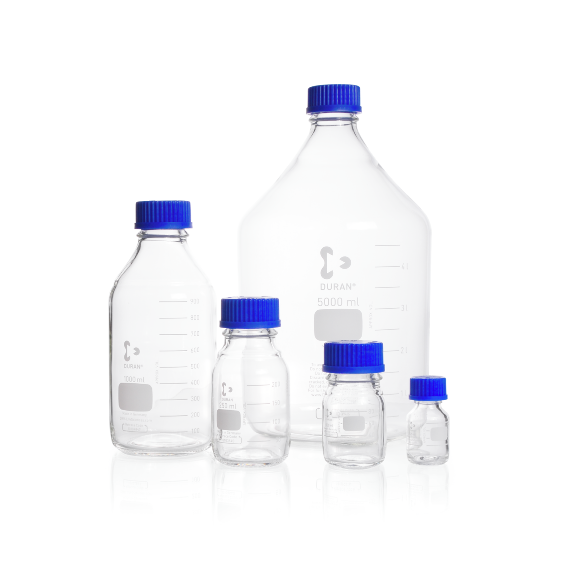a set of three bottles with blue caps
