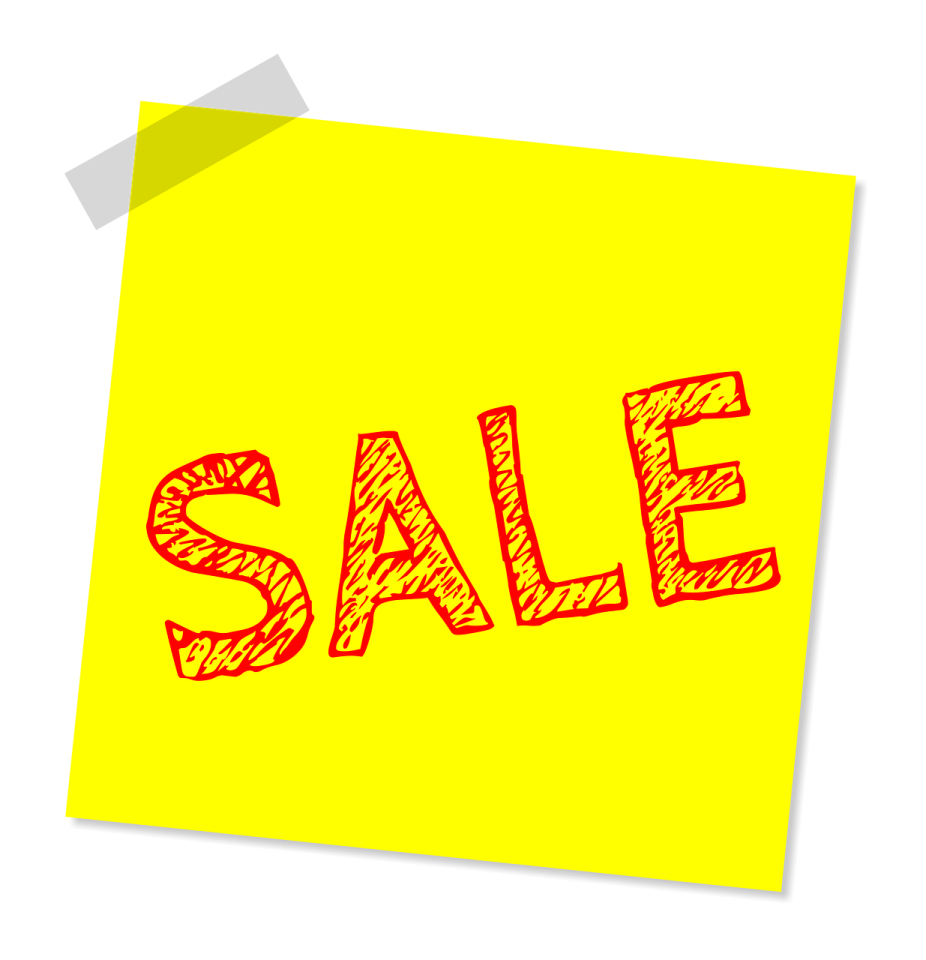 a post - it note with the word sale written on it