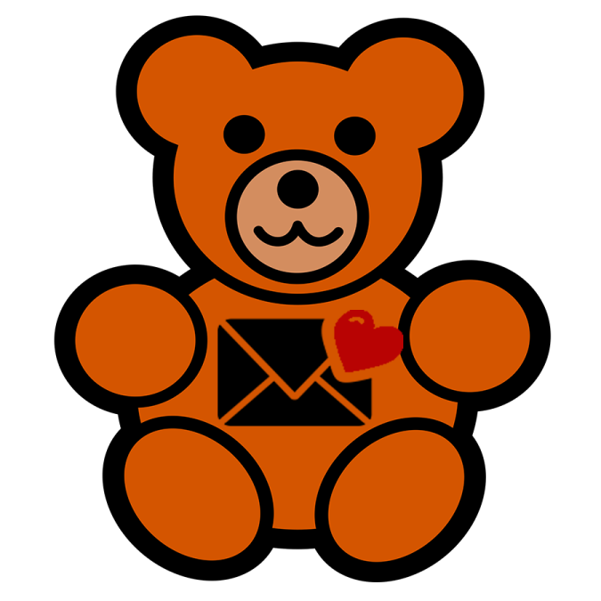 a brown teddy bear holding a red heart