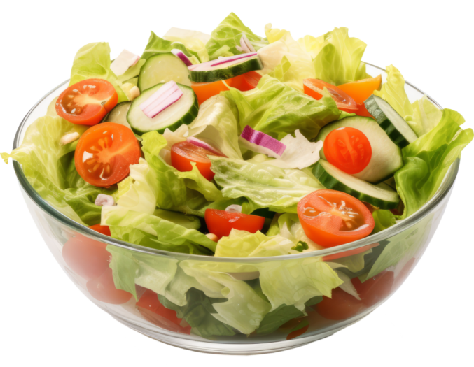 a salad in a glass bowl on a white background