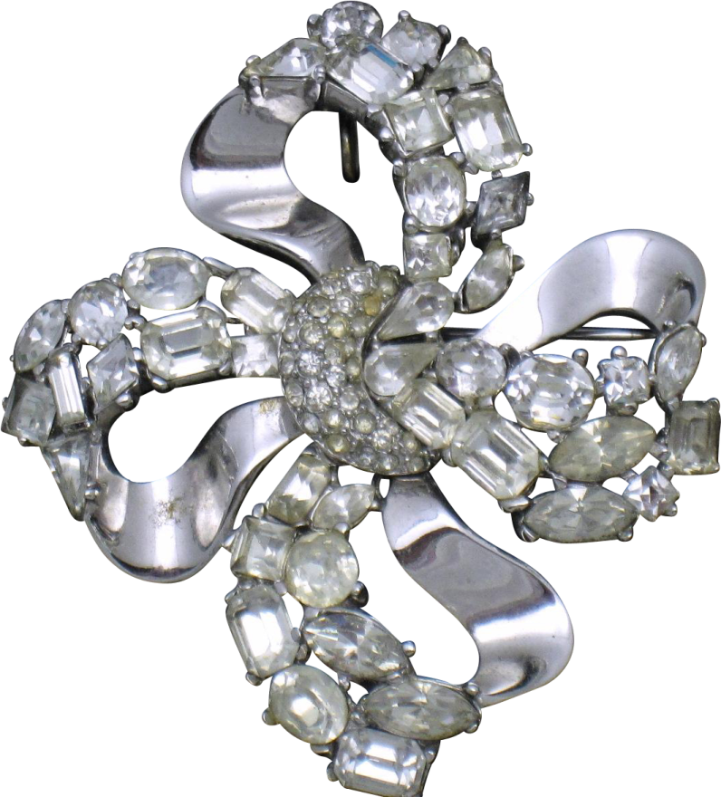 a silver and crystal flower broochle