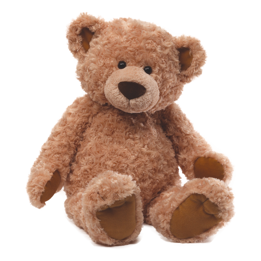 a brown teddy bear sitting on a white surface