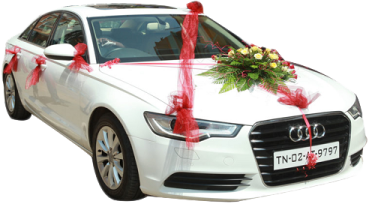 a white car with a bouquet on the hood