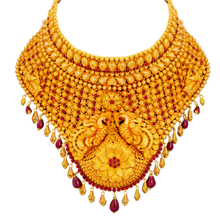 a gold necklace with red stones and pearls