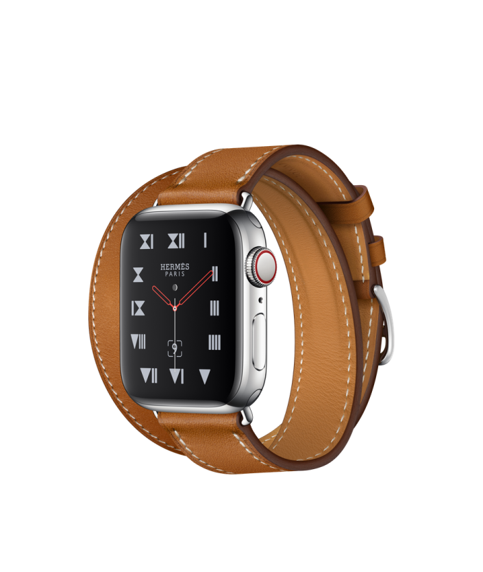 an apple watch with a brown leather band