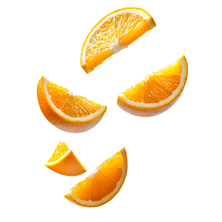 a group of oranges falling into the air