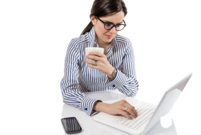a woman sitting at a desk using her laptop