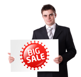 a man holding up a sign that says big sale