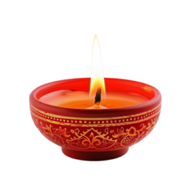 a red bowl with a lit candle in it