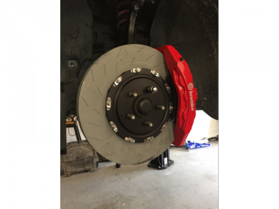 a red brake disc on a white background