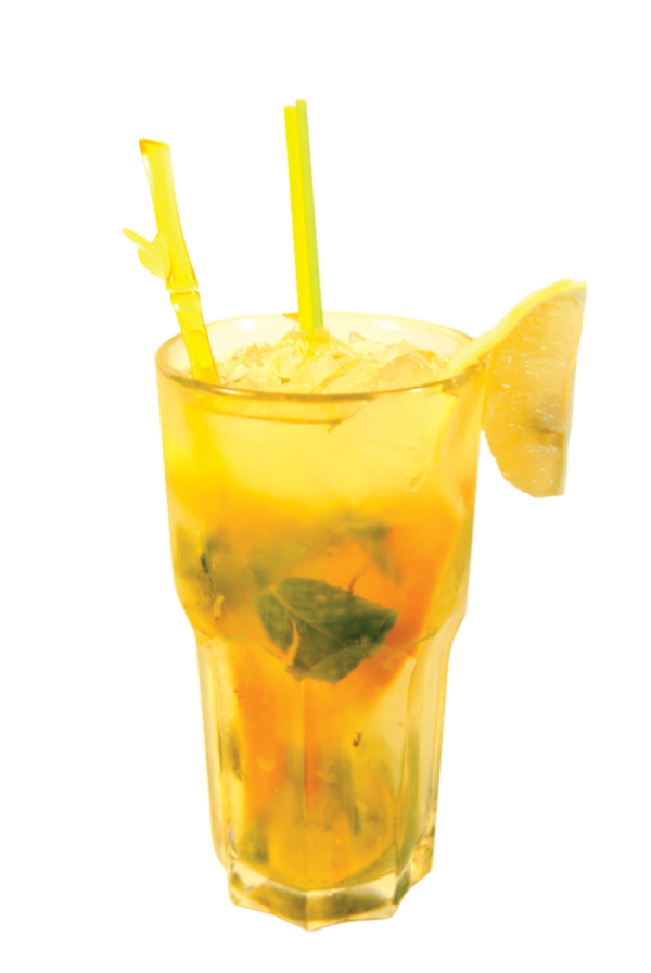 a glass filled with a drink and a lime slice
