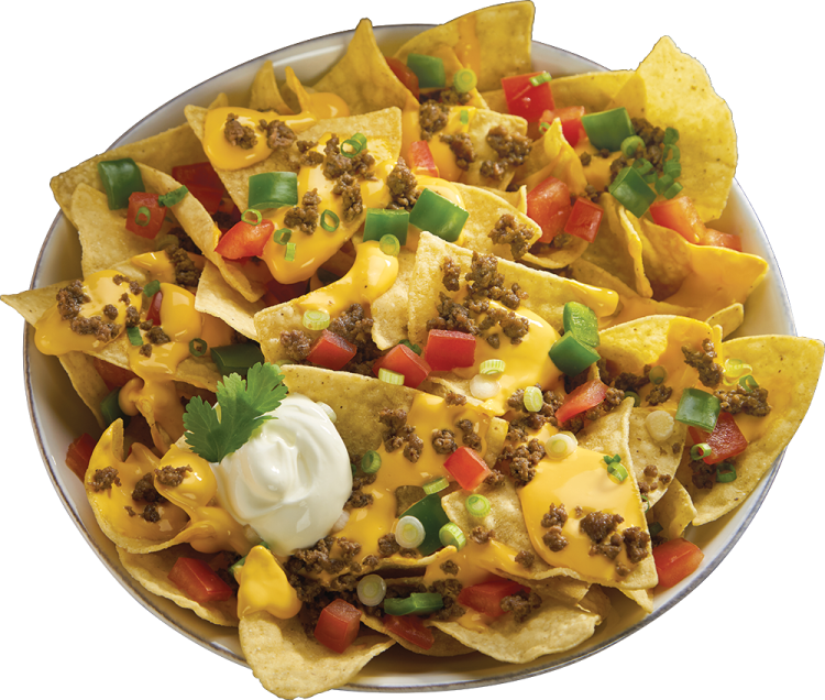 a bowl filled with nachos and topped with cheese