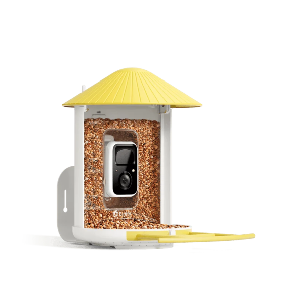 a white bird feeder with a yellow roof