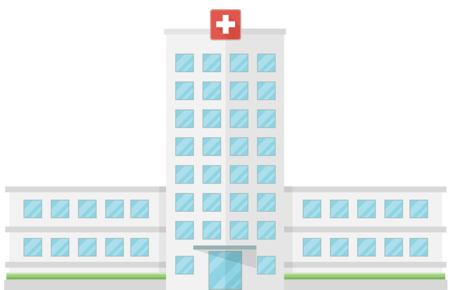 a hospital building with a red cross on top