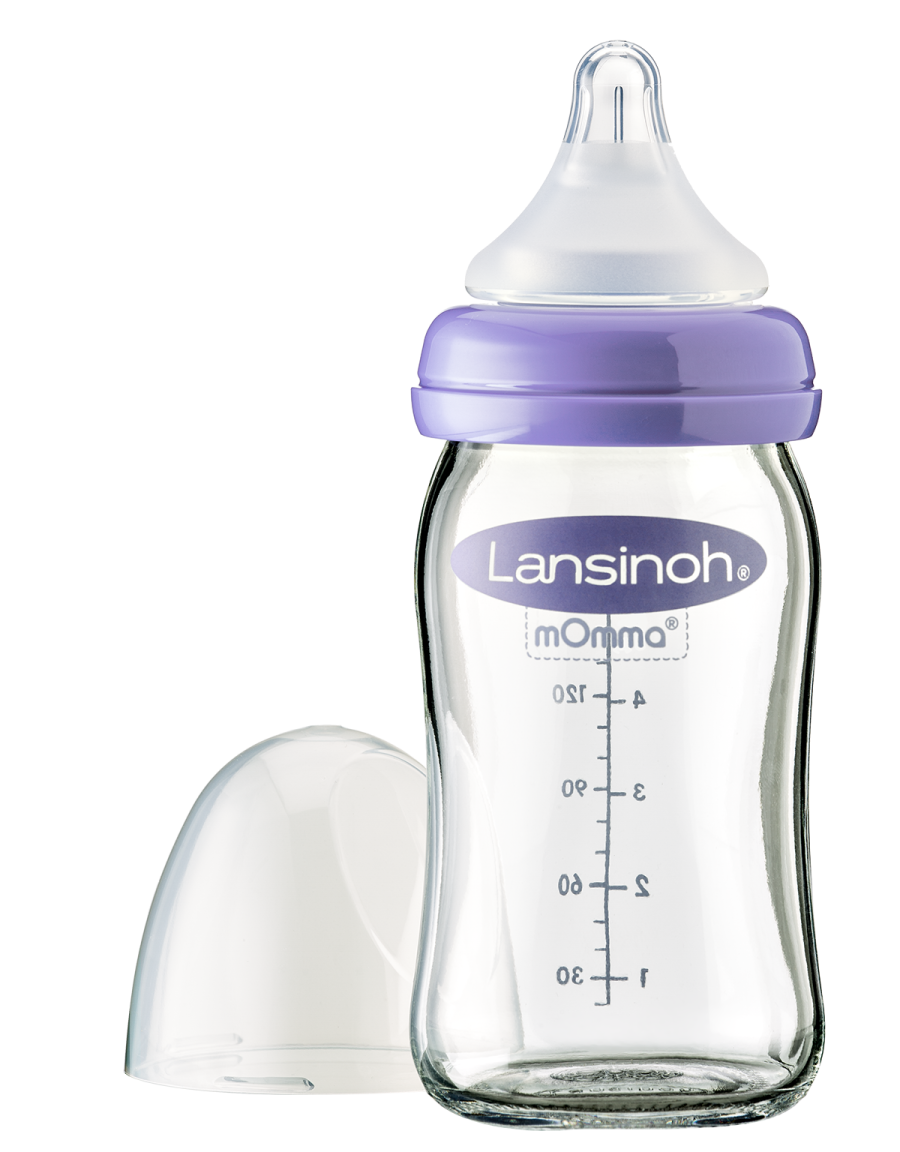 a baby bottle with the lid open