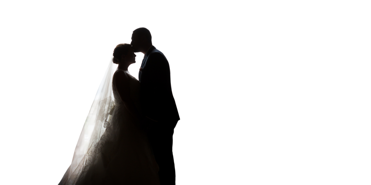 a bride and groom silhouetted against a white background