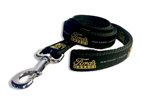 a black leash with gold lettering on it
