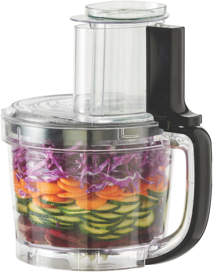a food processor with vegetables in it