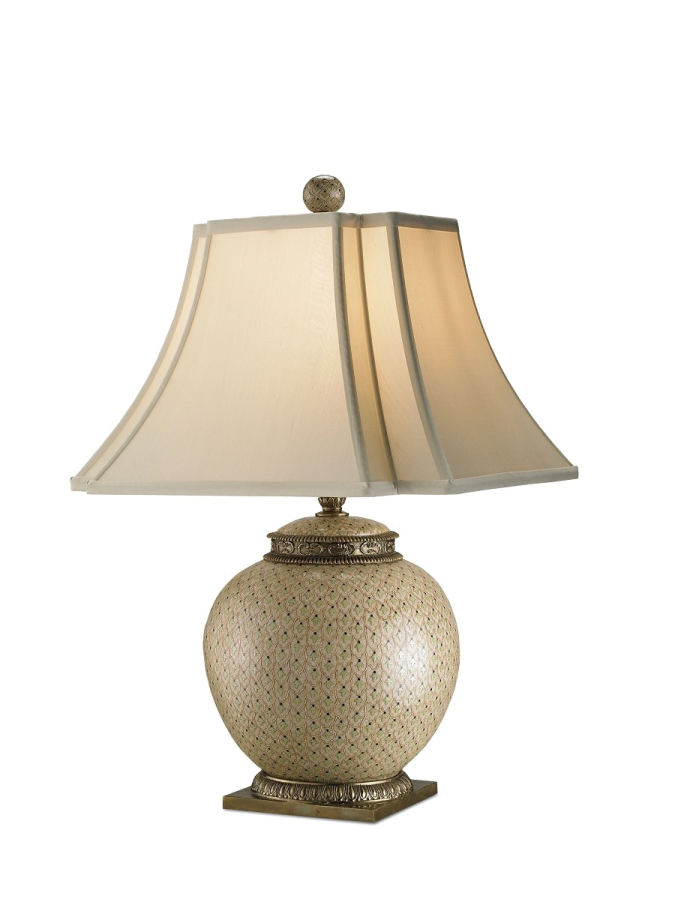 a table lamp with a beige shade