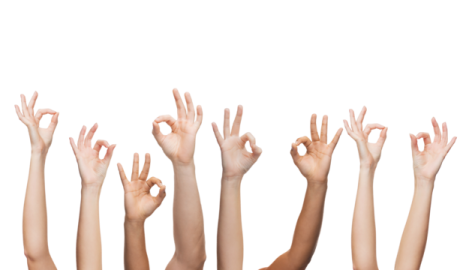 many hands raised up in the air