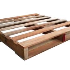 a wooden palle with two red handles