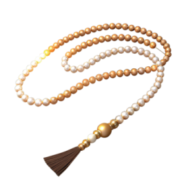 a white and brown rosary with a ta