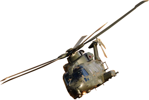 a military helicopter flying through the air