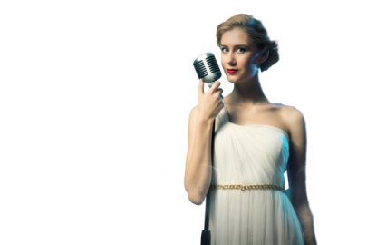 a woman in a white dress holding a microphone