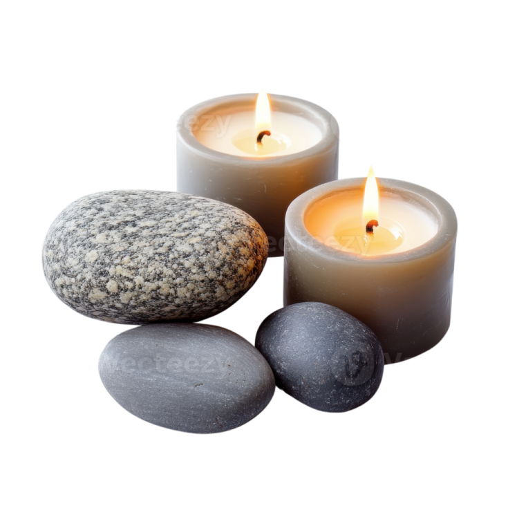 three candles and stones on a white background