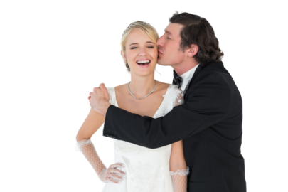 a bride and groom kissing on their wedding day