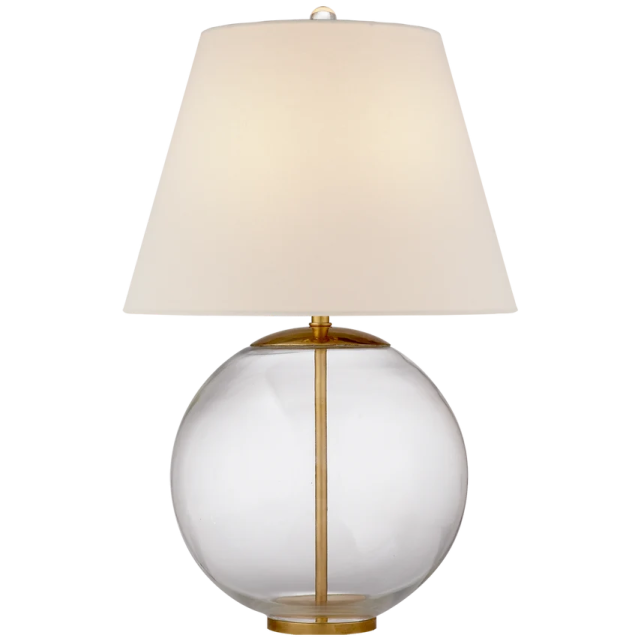 a glass table lamp with a white shade