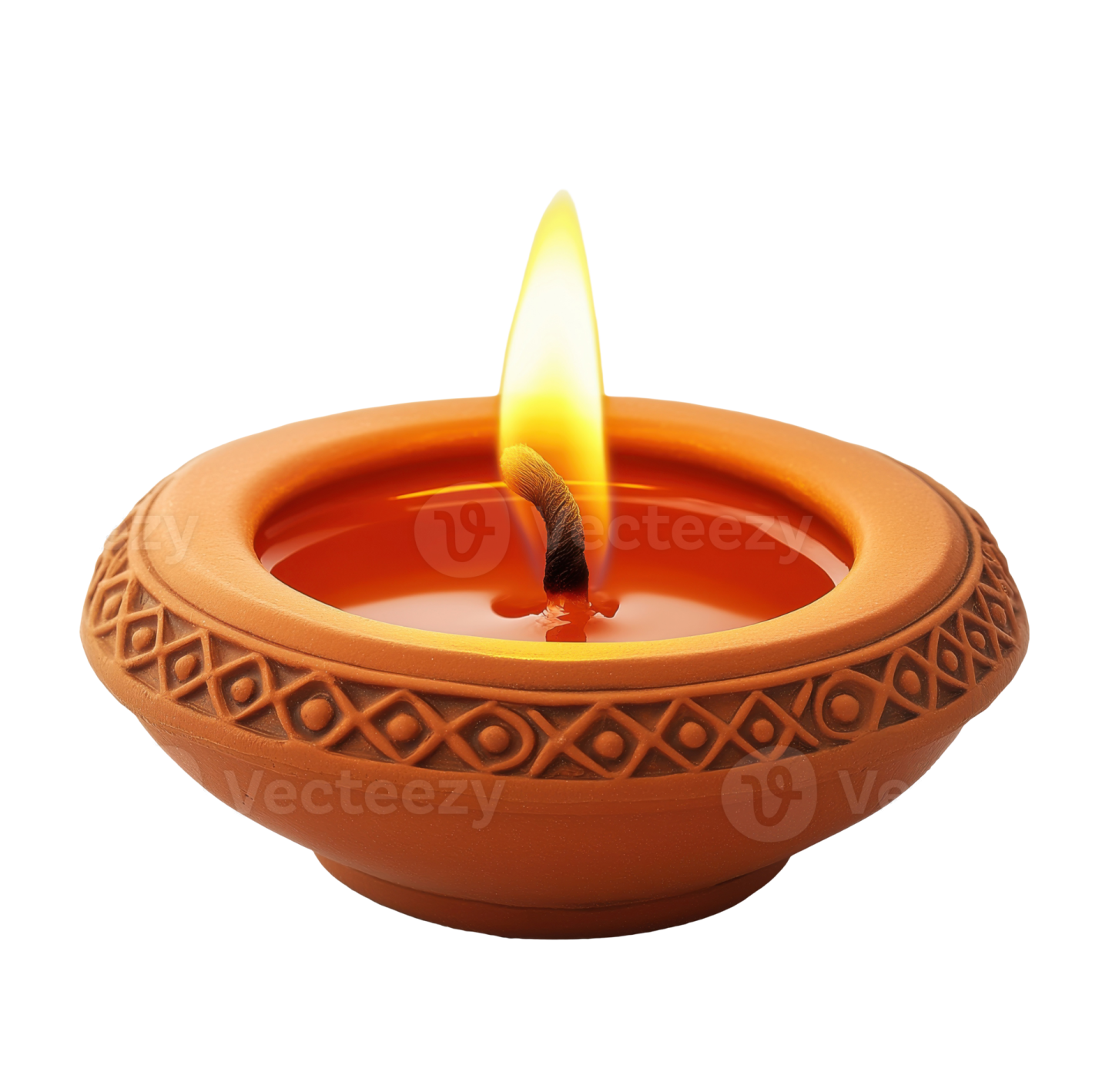 a clay oil lamp with a flame