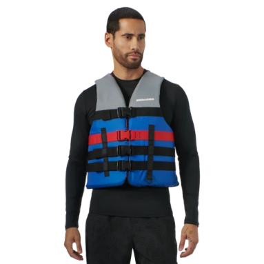 a man wearing a blue and red life jacket