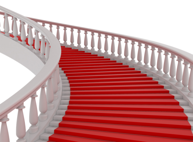 a staircase with red carpet and white railing