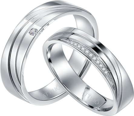 a pair of white gold wedding rings with diamonds