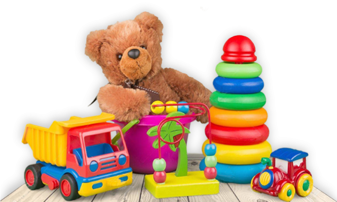 a teddy bear sitting next to a pile of toys
