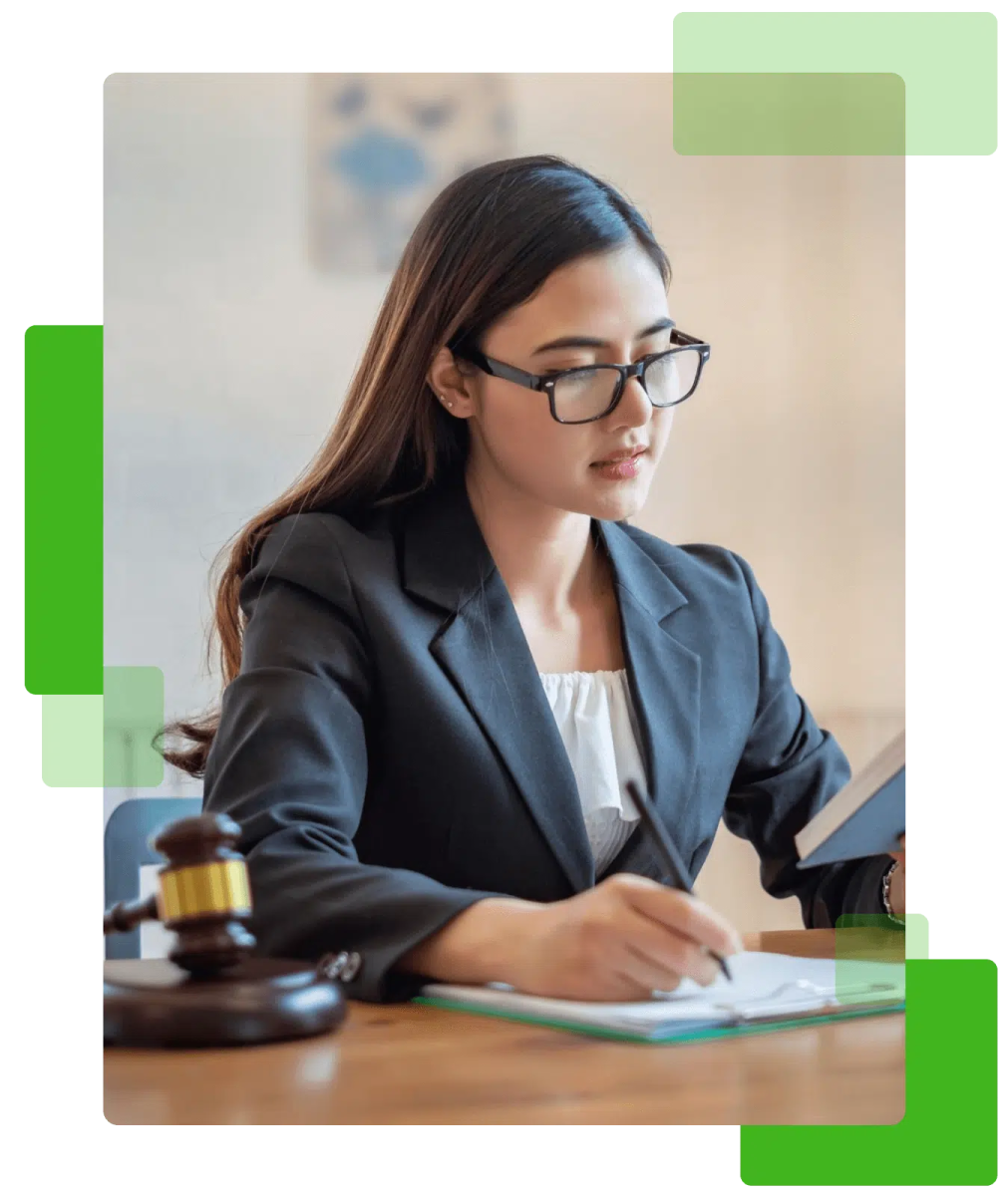 a woman in a business suit sitting at a desk