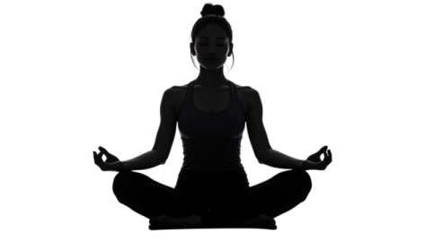 a silhouette of a woman doing yoga