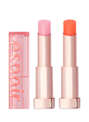 a close up of two lipsticks on a white background