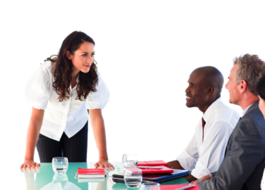 a group of people sitting around a conference table
