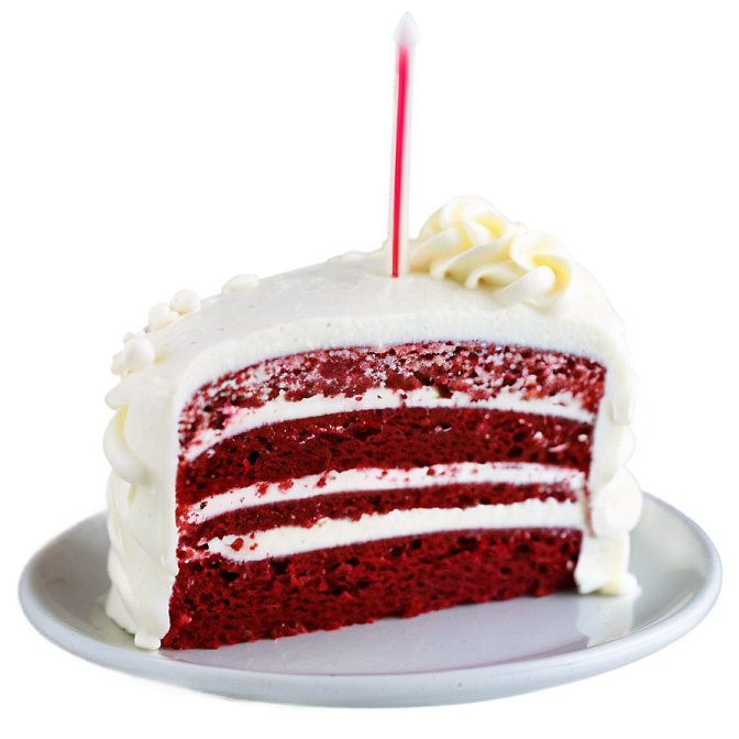 a slice of red velvet cake with white frosting