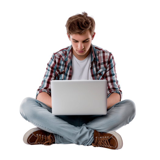 a young man sitting on the floor using a laptop