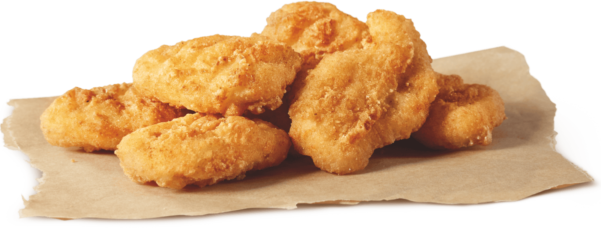 a pile of fried chicken nus on a piece of paper